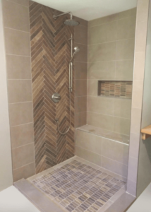 Houndstooth grown shower tile in glass bathroom stall