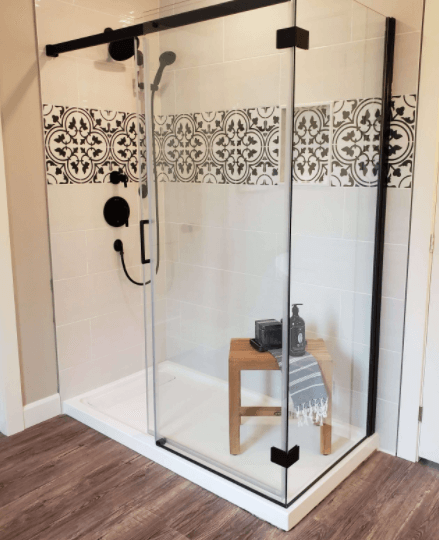 graphic tile in glass bathroom shower stall