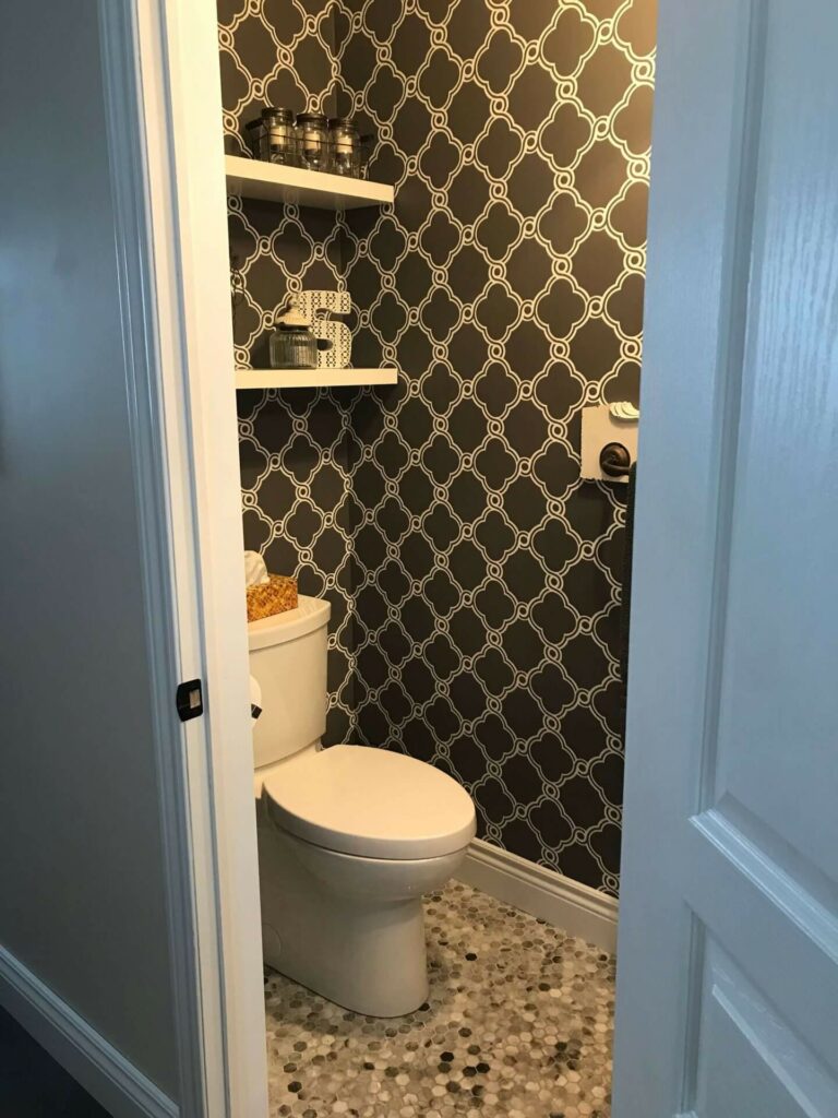 Open concept shelving in a small powder room